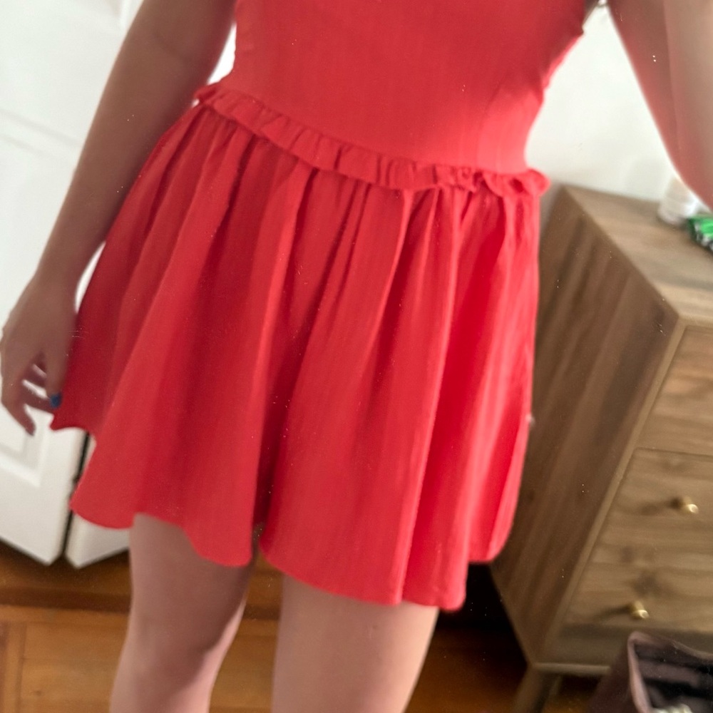 Red Jumpsuit with Flowy Silhouette and Pleated Design